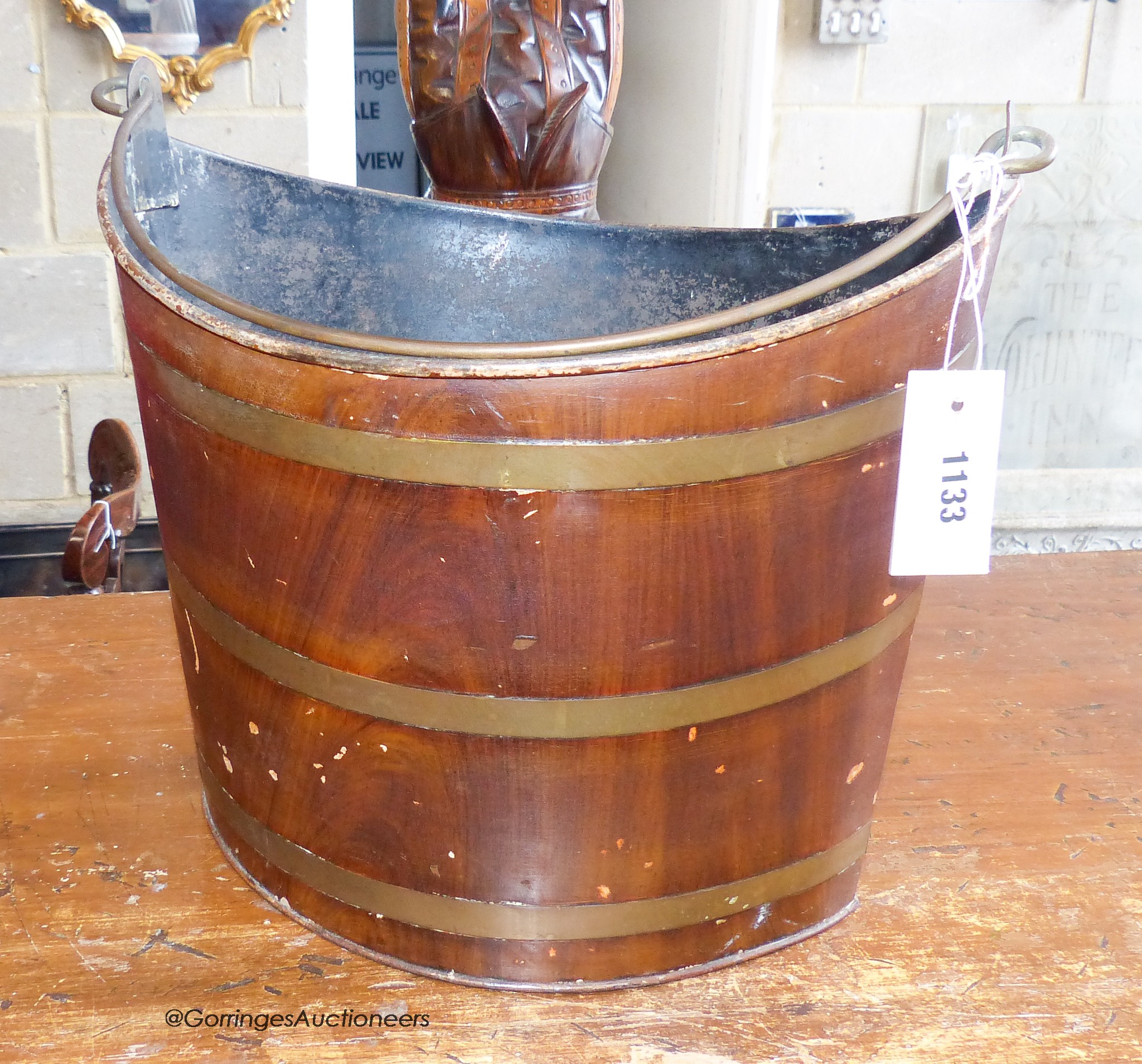 A Victorian toleware peat bucket of elliptical form. W-38, H-34cm.